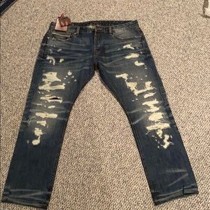 cult of individuality dark wash ripped jeans
